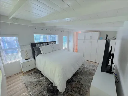 a bed room with a bed and a window