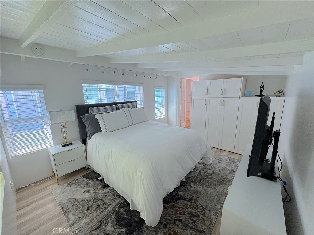 726 1/2 Esplanade Redondo Beach, CA 90277 - Photo 9 of 26 a bed room with a bed and a window