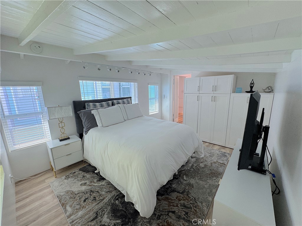 726 1/2 Esplanade Redondo Beach, CA 90277 - Photo 10 of 26 a bed room with a bed and a window