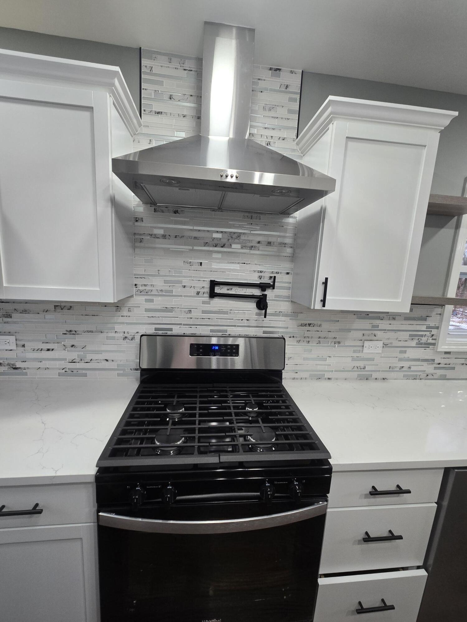 2100 West 2nd Avenue Gary, IN 46404 - Photo 7 of 22 a stove top oven sitting inside of a kitchen