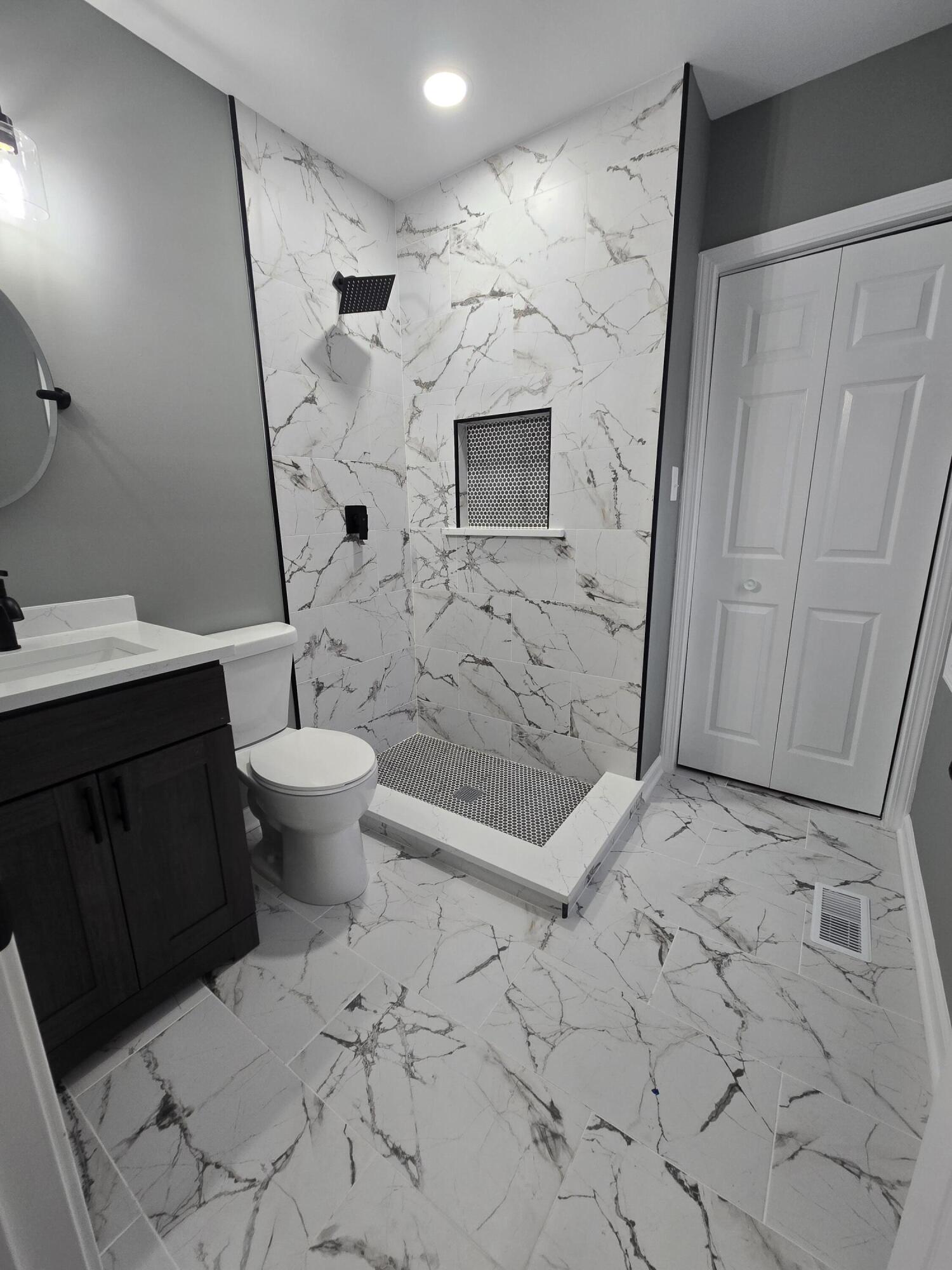 2100 West 2nd Avenue Gary, IN 46404 - Photo 10 of 22 a bathroom with a sink and a mirror