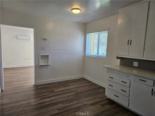 a room with hard wood floors and a sink