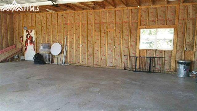 27055 Handle Road Calhan, CO 80808 - Photo 24 of 25 A view towards the south end of the garage. Has been insulated.