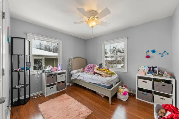 a bedroom with furniture and a window