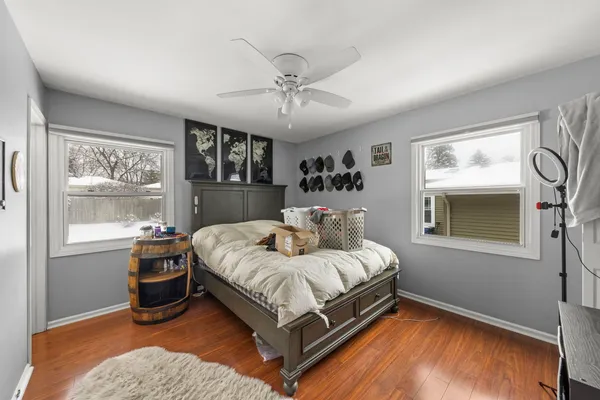 a bedroom with a large bed and a window