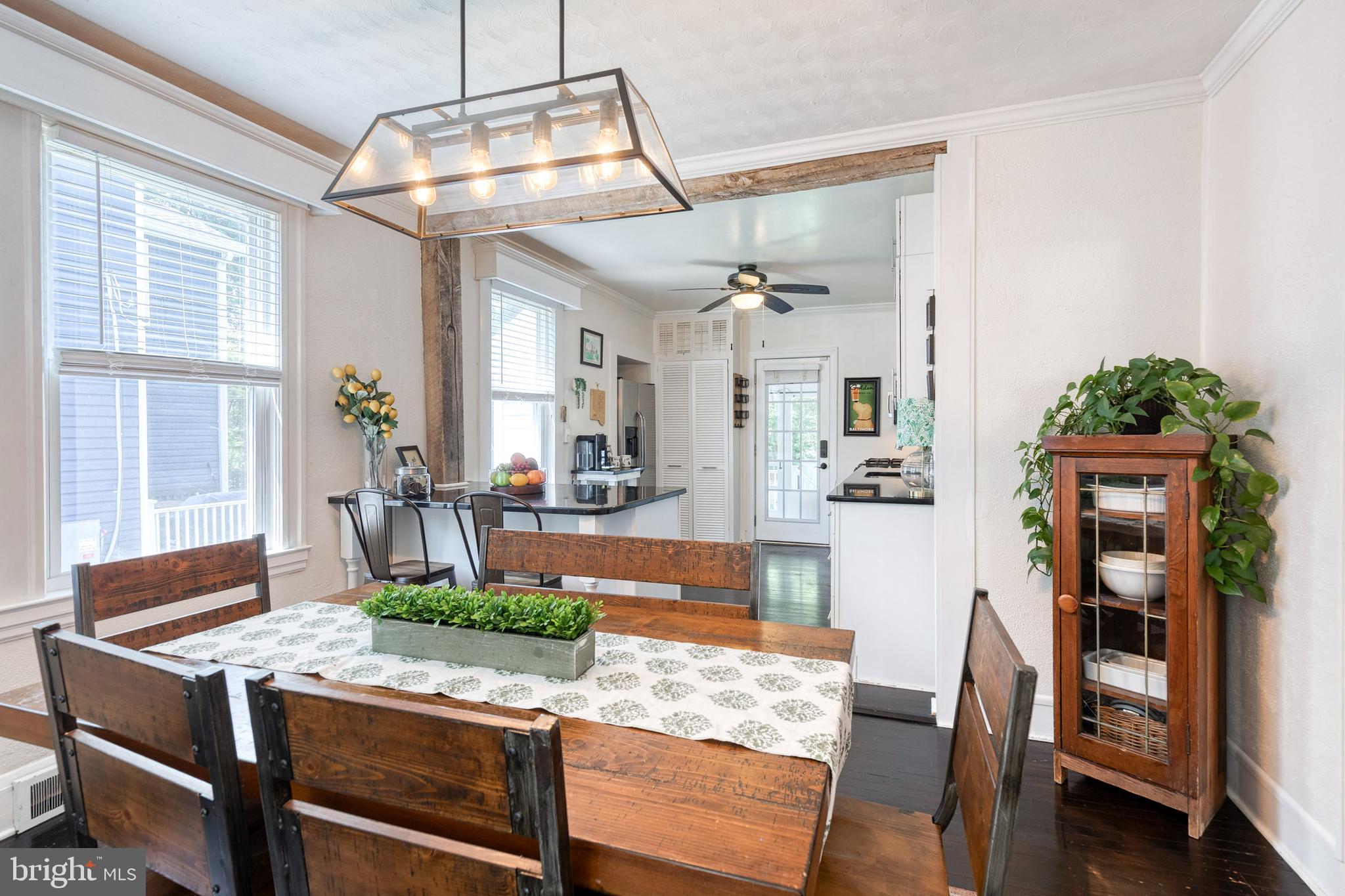 6504 Maplewood Road Baltimore, MD 21212 - Photo 12 of 45 a view of a dining room with furniture and wooden floor