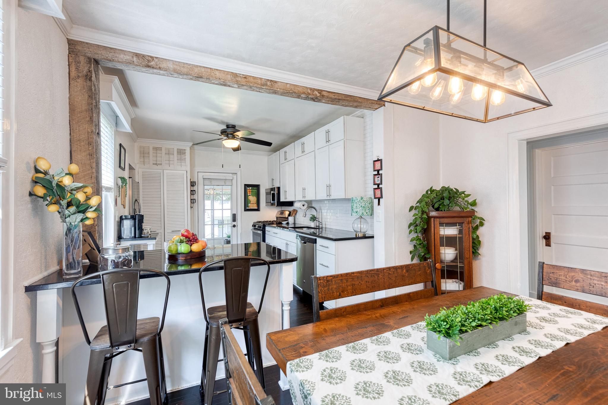 6504 Maplewood Road Baltimore, MD 21212 - Photo 14 of 45 a view of a dining room with furniture and wooden floor