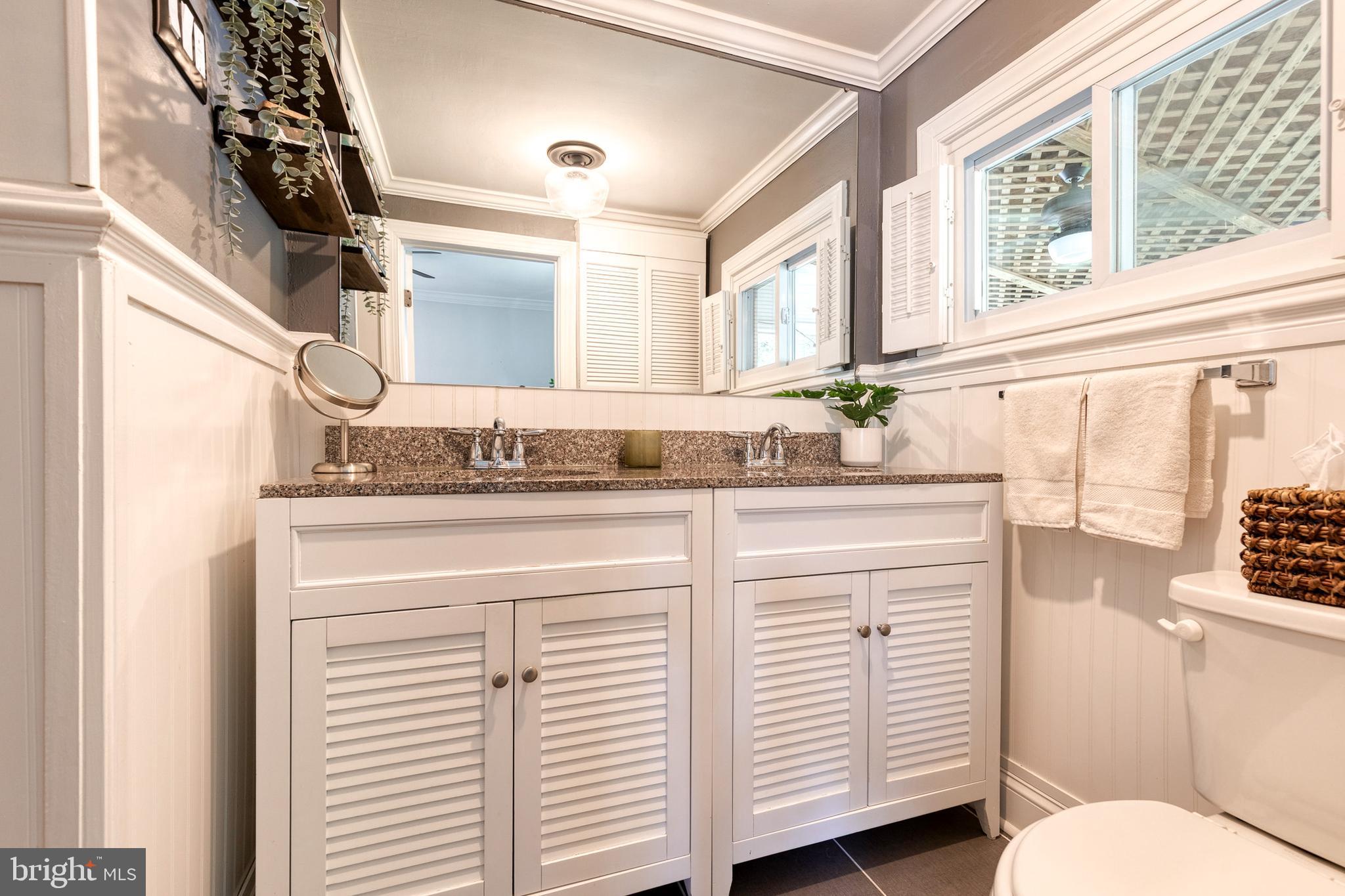 6504 Maplewood Road Baltimore, MD 21212 - Photo 22 of 45 a bathroom with a sink and a vanity