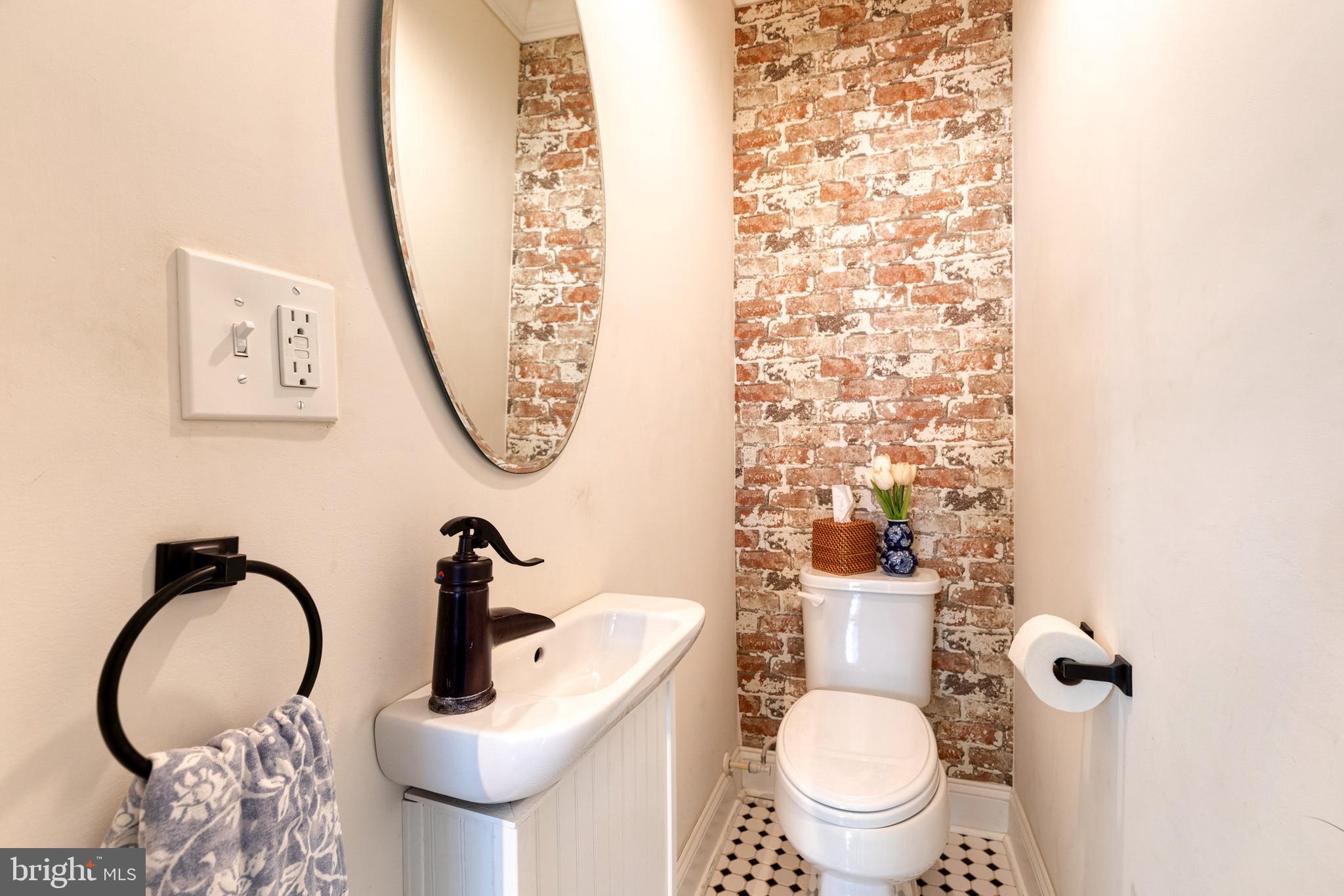 6504 Maplewood Road Baltimore, MD 21212 - Photo 23 of 45 a bathroom with a toilet and a sink