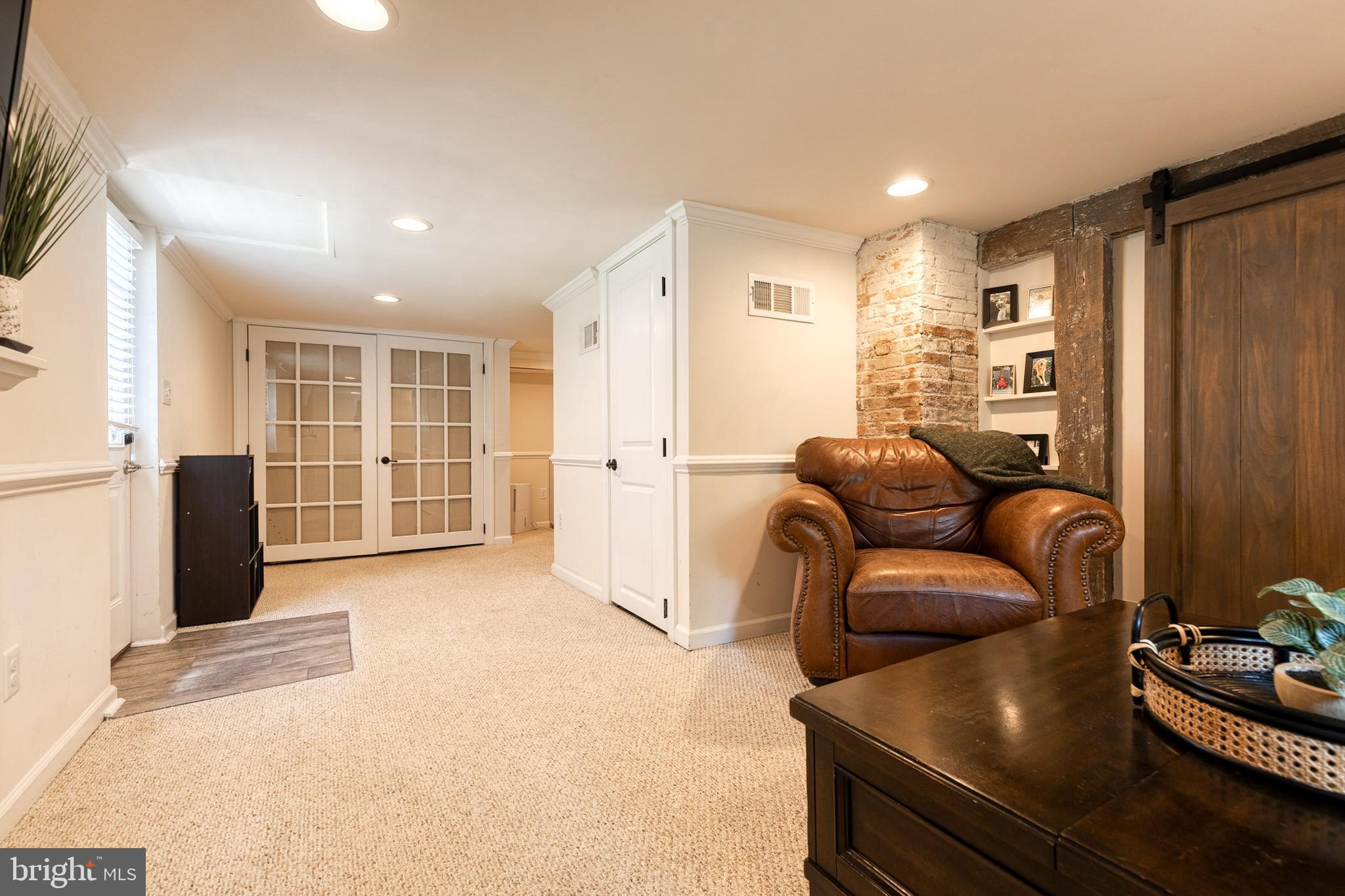 6504 Maplewood Road Baltimore, MD 21212 - Photo 28 of 45 a living room with furniture and a flat screen tv