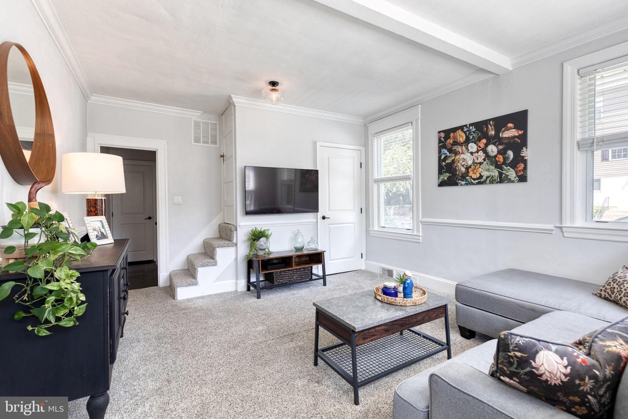6504 Maplewood Road Baltimore, MD 21212 - Photo 3 of 45 a living room with furniture and a flat screen tv
