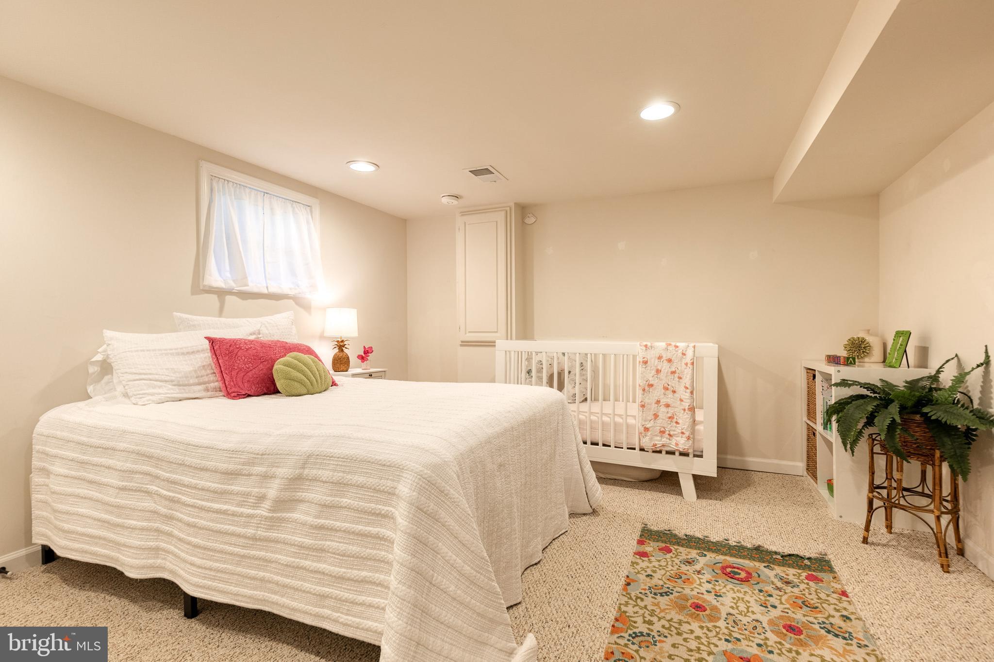 6504 Maplewood Road Baltimore, MD 21212 - Photo 31 of 45 a bedroom with a bed and a couch