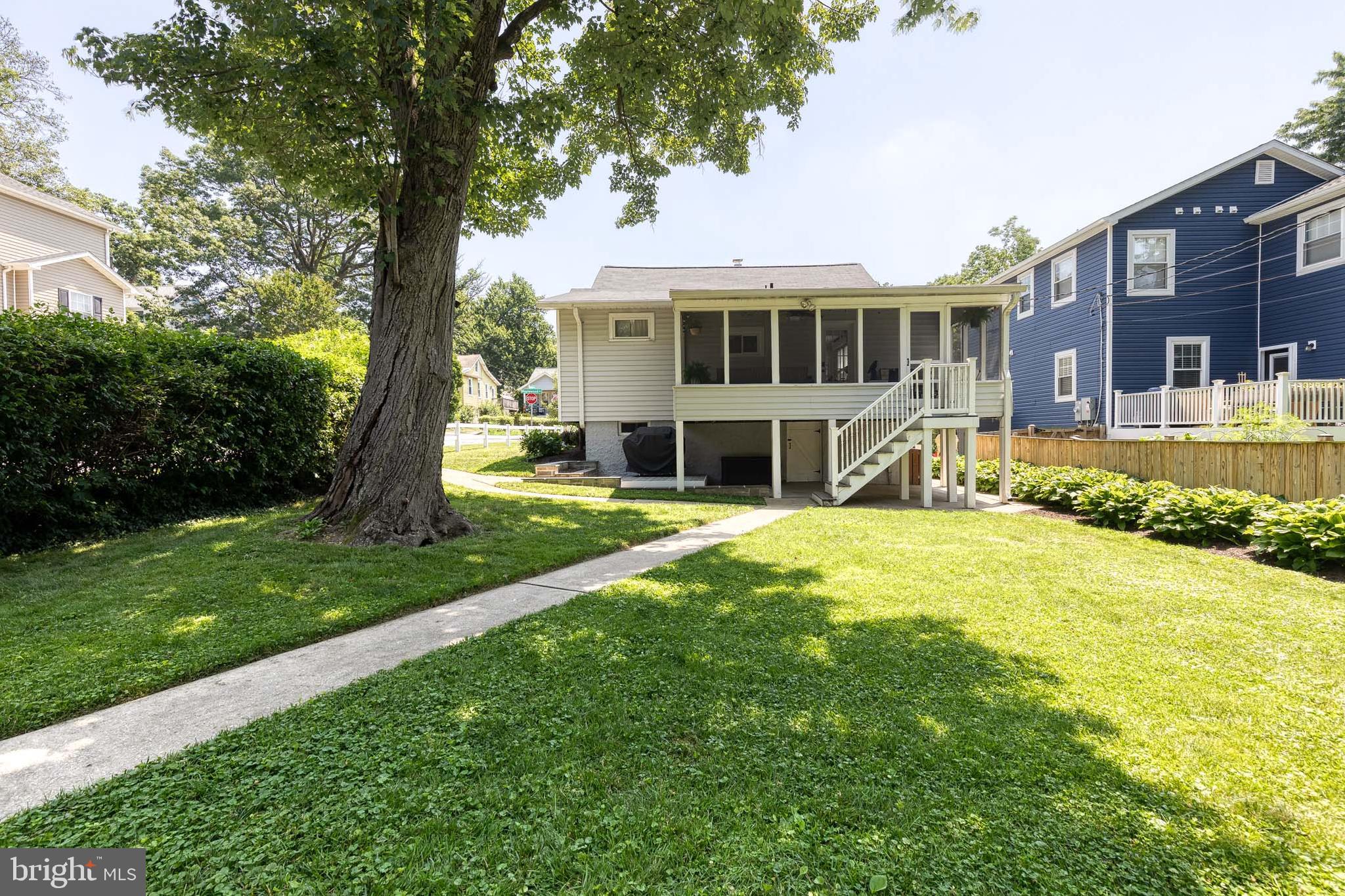 6504 Maplewood Road Baltimore, MD 21212 - Photo 40 of 45 a front view of a house with a yard table and chairs