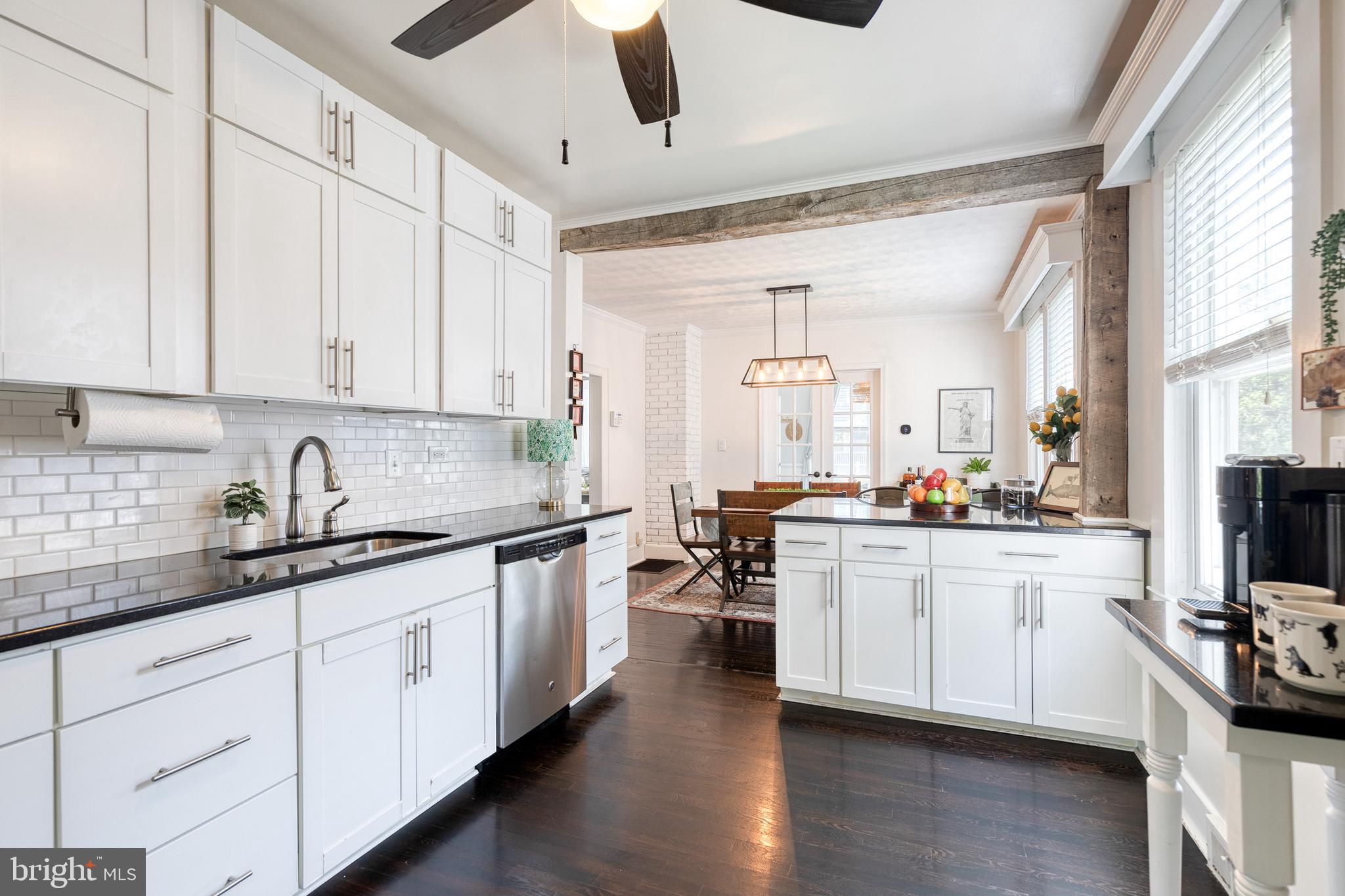 6504 Maplewood Road Baltimore, MD 21212 - Photo 8 of 45 a kitchen with sink stove and cabinets