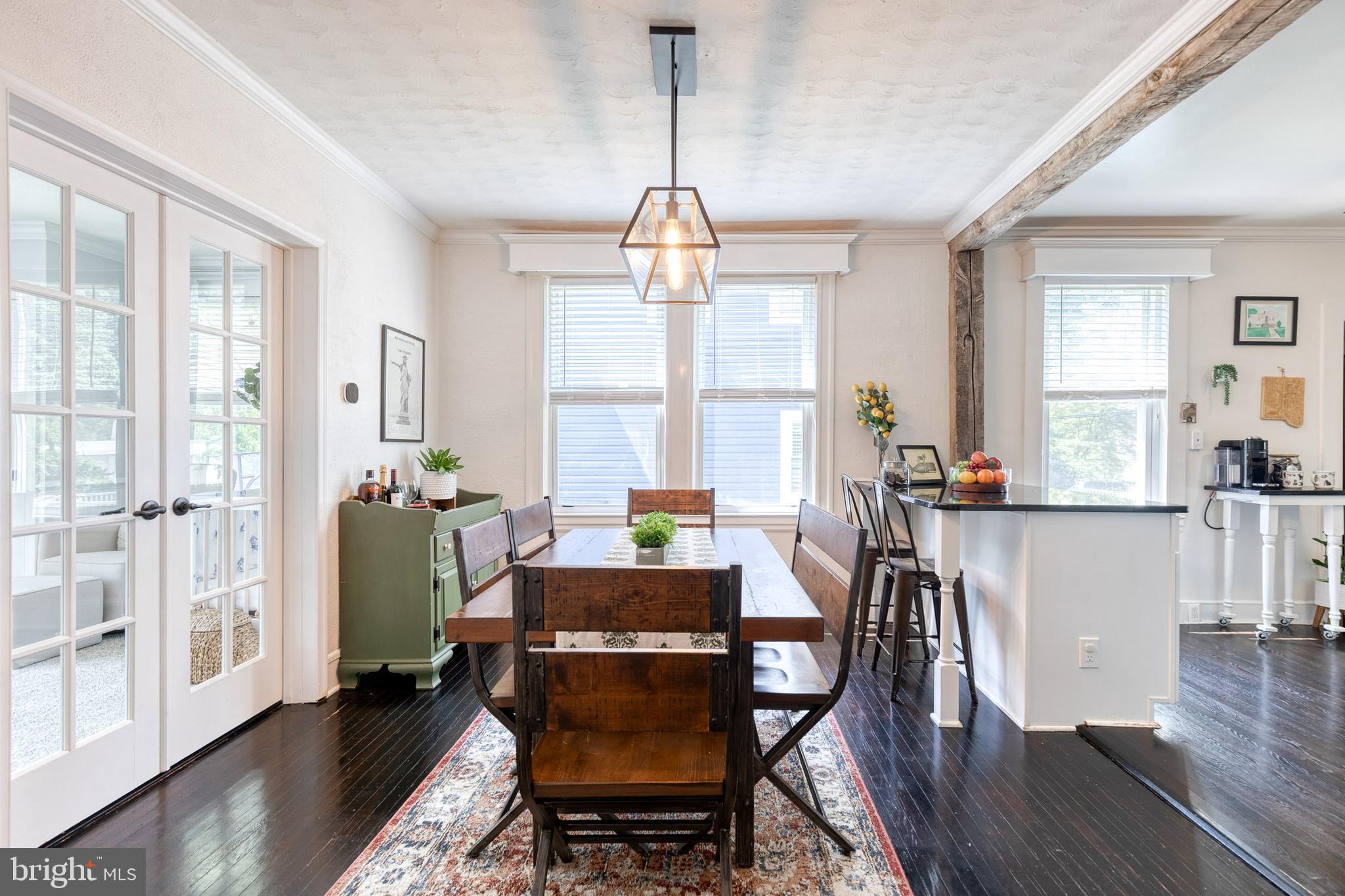 6504 Maplewood Road Baltimore, MD 21212 - Photo 10 of 45 a view of a dining room with furniture window and wooden floor