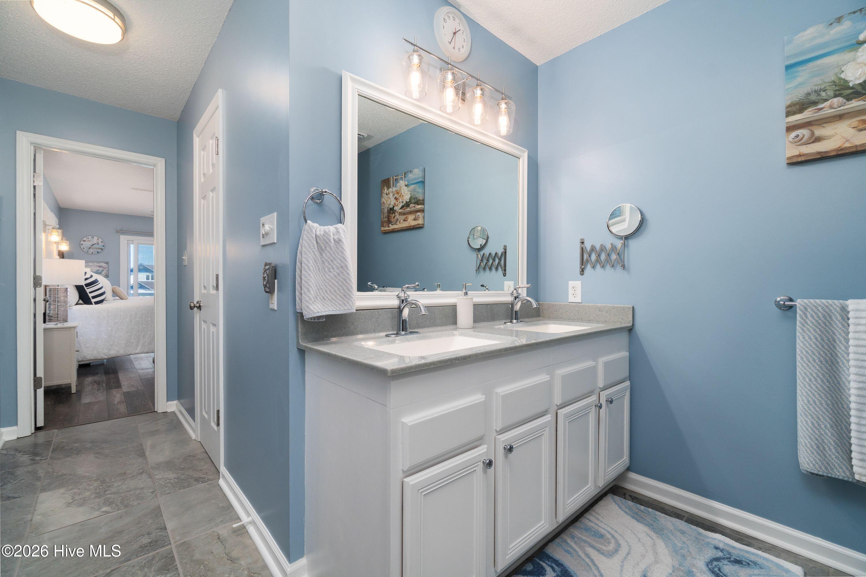 330 Cape Lookout Loop Emerald Isle, NC 28594 - Photo 36 of 80 Master Bath with beautiful sea glass type colored counter top ! You have to see it!