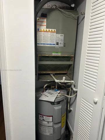 a utility room with washer and dryer