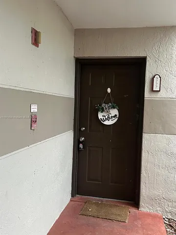 a view of a hallway with front door