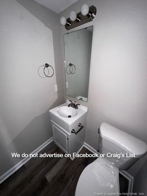 6473 Yadkin Road, Unit 23 Fayetteville, NC 28303 - Photo 3 of 8 a bathroom with a sink mirror vanity and toilet