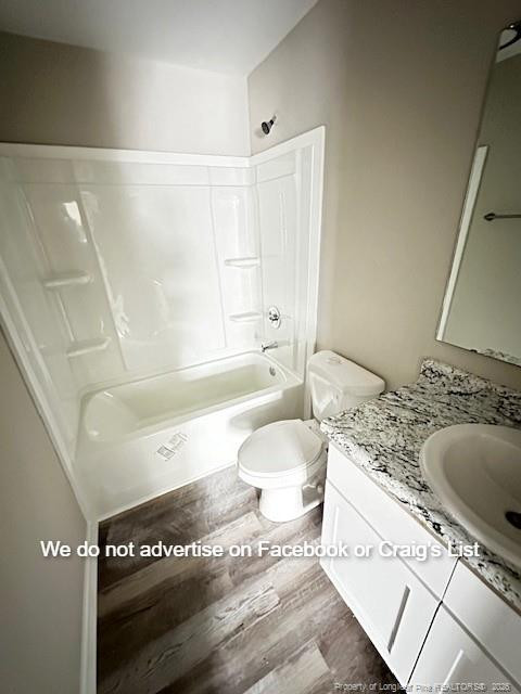 6473 Yadkin Road, Unit 23 Fayetteville, NC 28303 - Photo 7 of 8 a spacious bathroom with a granite countertop sink a toilet and bathtub