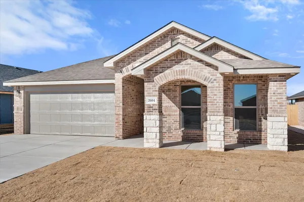 a front view of a house with a garage