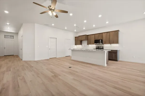 a view of kitchen with wooden floor and window