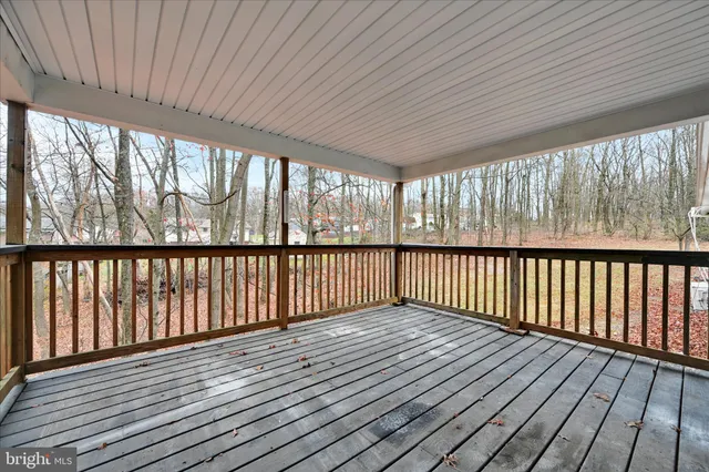 a view of wooden balcony with wooden floor