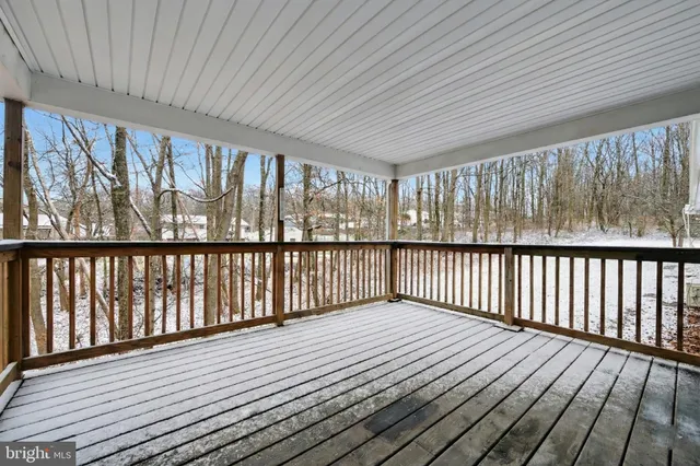 a view of wooden balcony with wooden floor