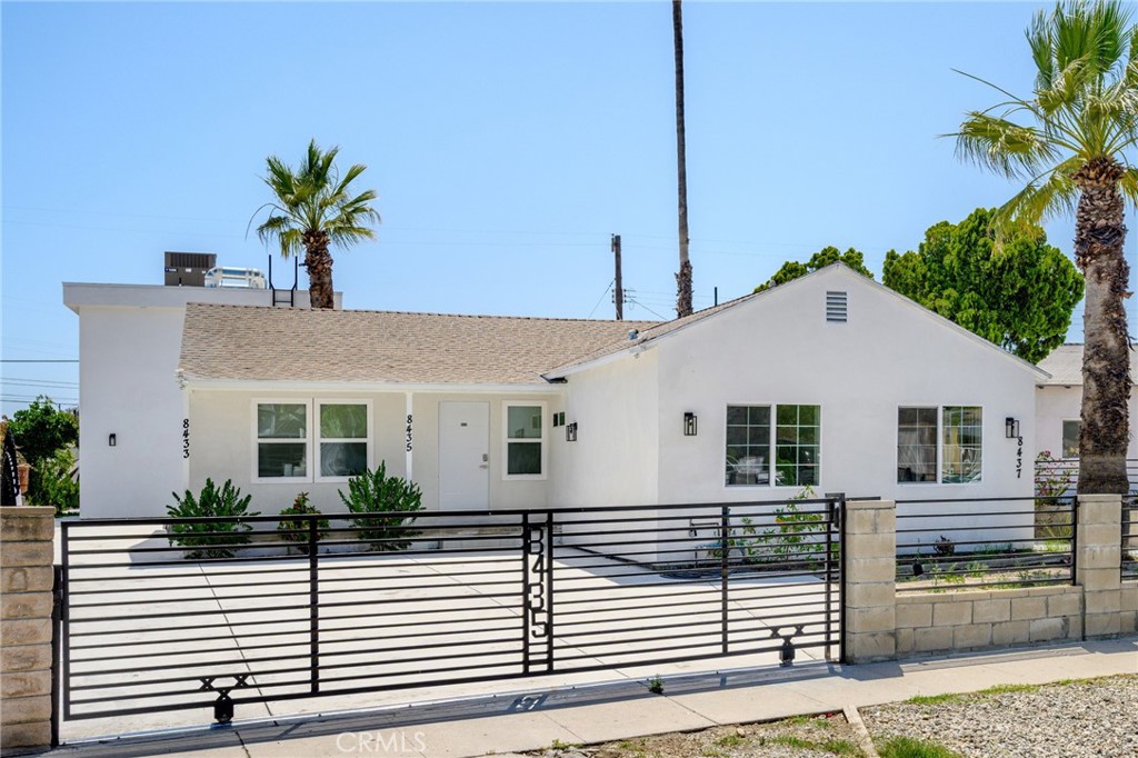 8435 Rincon Avenue Sun Valley, CA 91352 - Photo 23 of 61 a view of a white house with a white roof