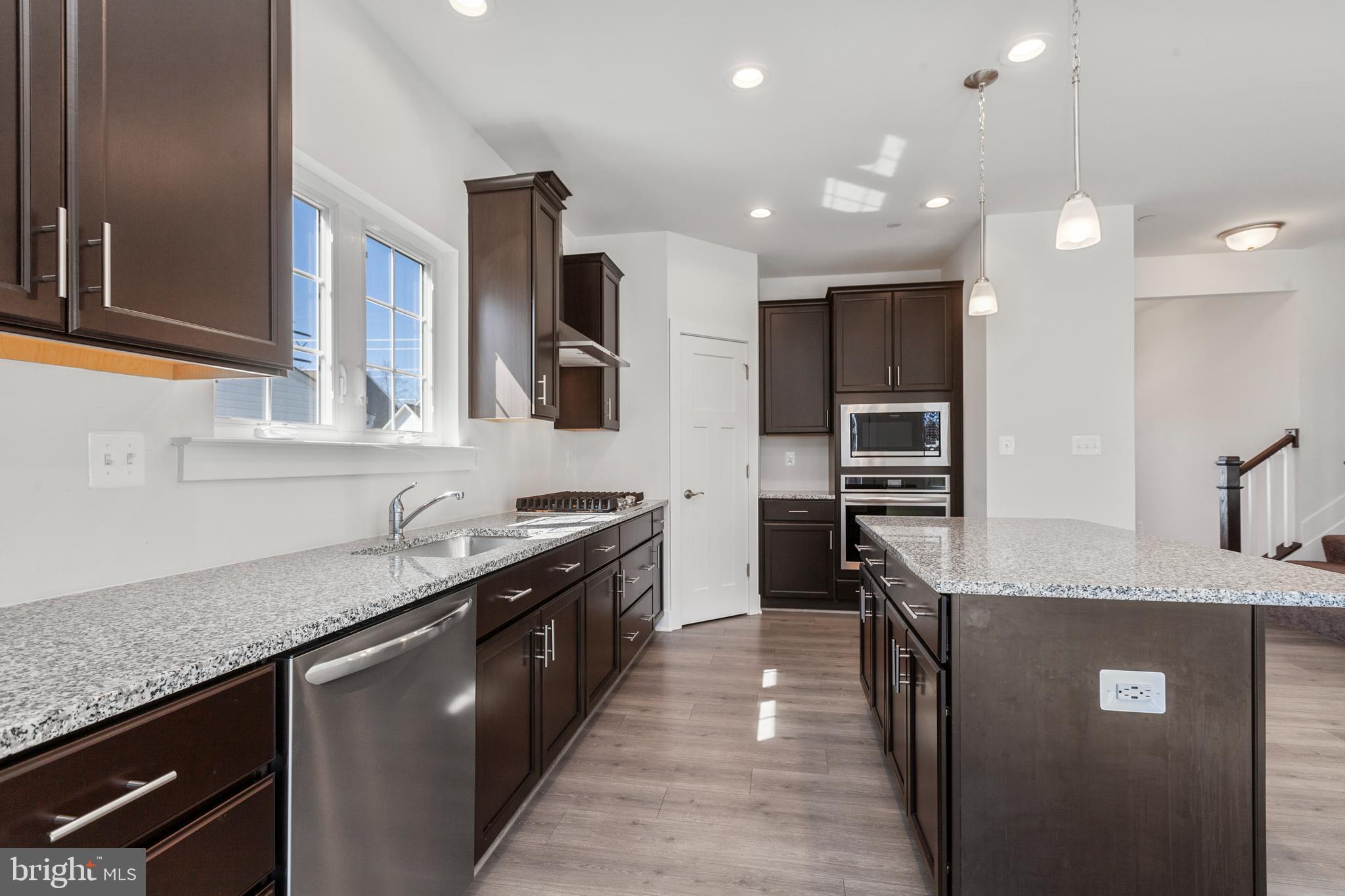 2517 Easy Street Fallston, MD 21047 - Photo 9 of 44 a kitchen with stainless steel appliances granite countertop a sink a stove and a refrigerator