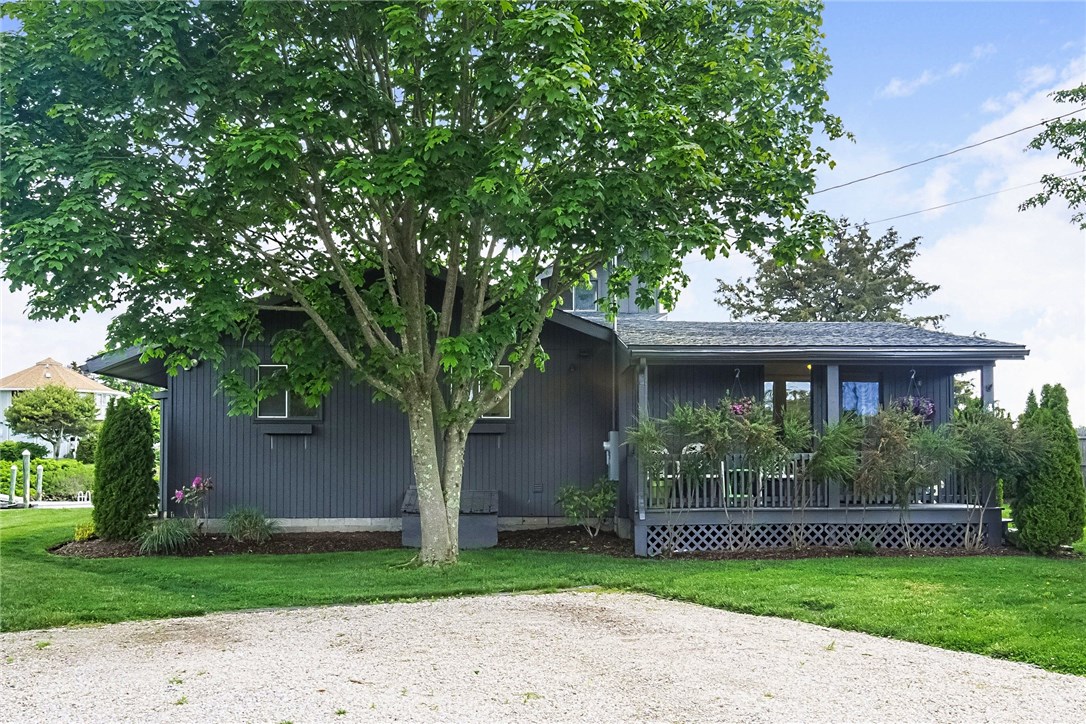 4 Shell Drive Westerly, RI 02891 - Photo 2 of 35 Front of home with a covered porch and shady maple tree