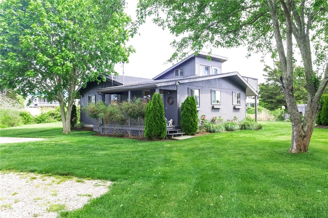 4 Shell Drive Westerly, RI 02891 - Photo 4 of 35 Lush green lawn with beautifully landscaped grounds