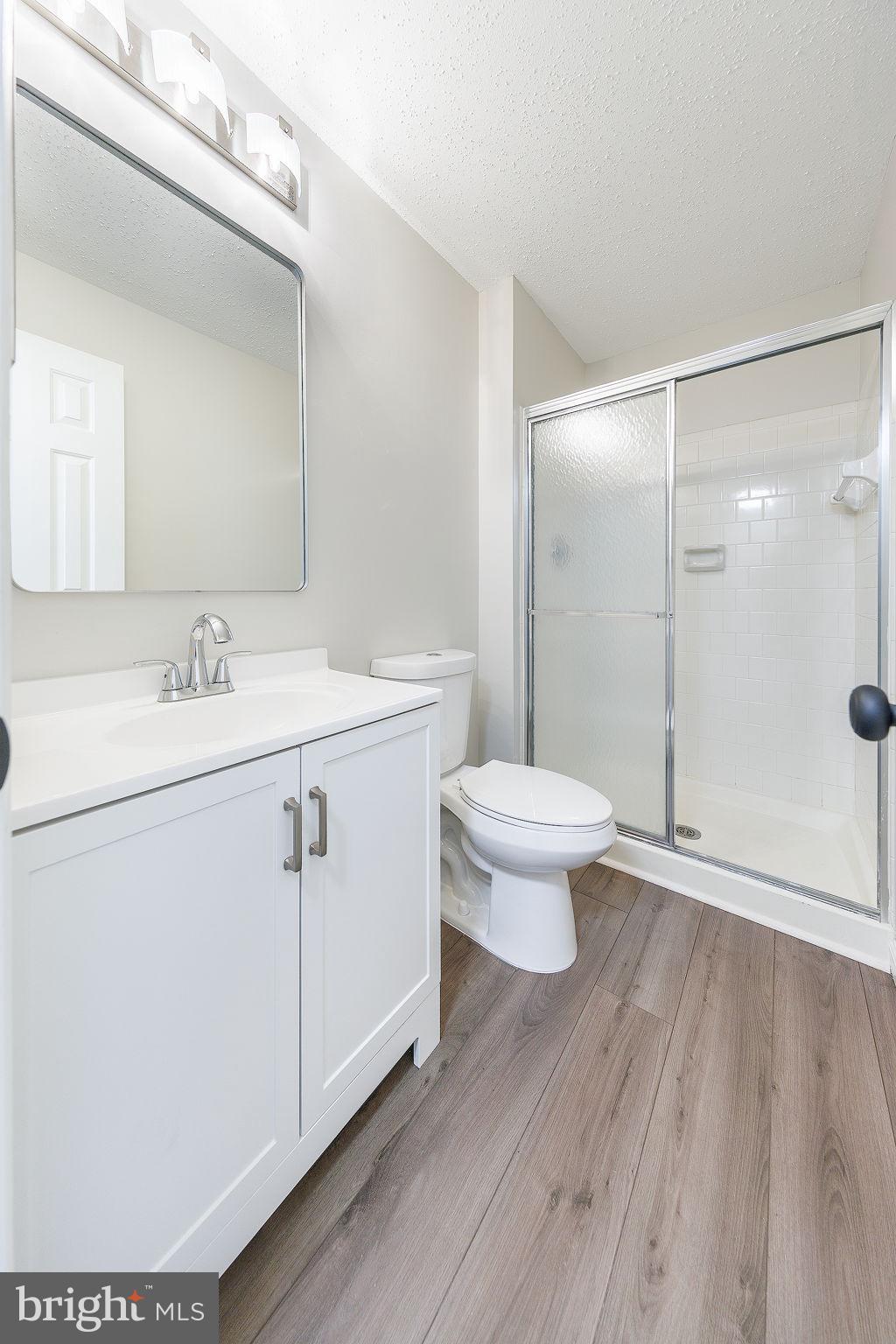 118 Fort Evans Road Southeast, Unit C Leesburg, VA 20175 - Photo 24 of 35 a view of bathroom with a sink toilet and a mirror