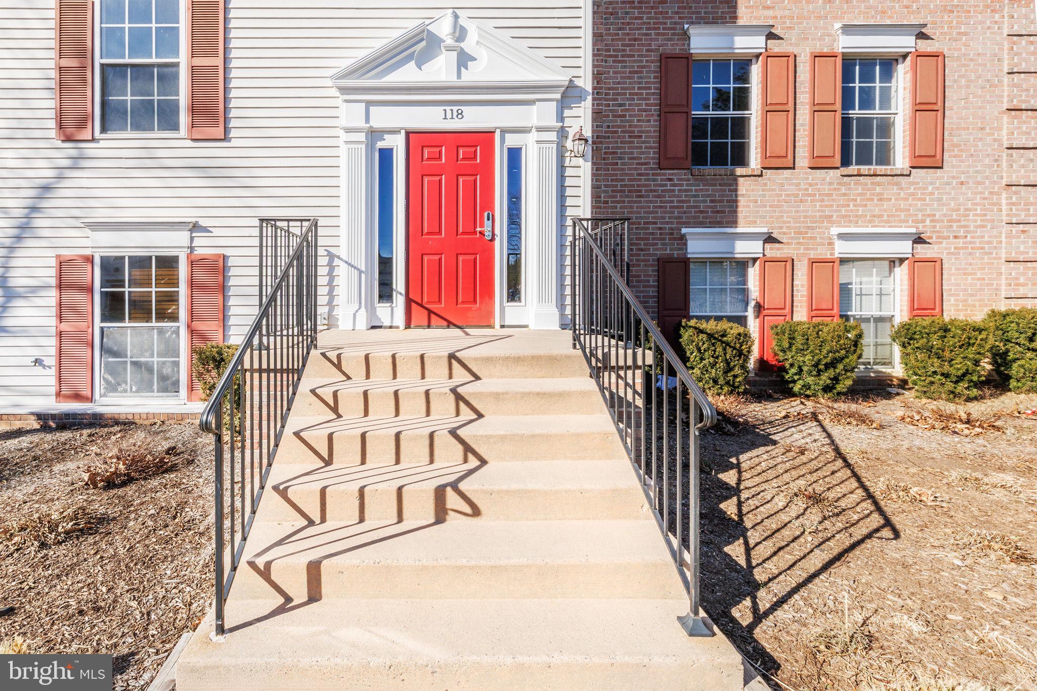 118 Fort Evans Road Southeast, Unit C Leesburg, VA 20175 - Photo 3 of 35 a view of a brick house with many windows