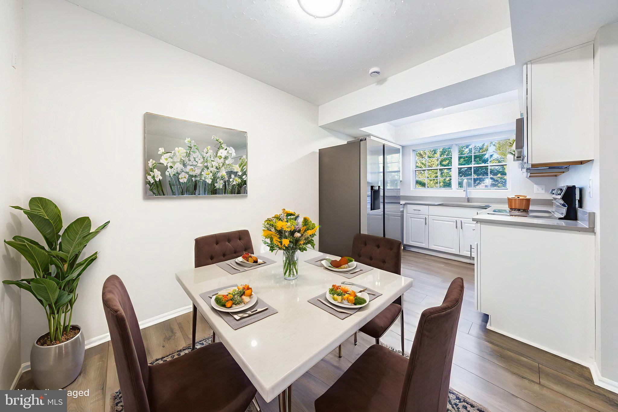 118 Fort Evans Road Southeast, Unit C Leesburg, VA 20175 - Photo 7 of 35 a view of a dining room with furniture window and wooden floor