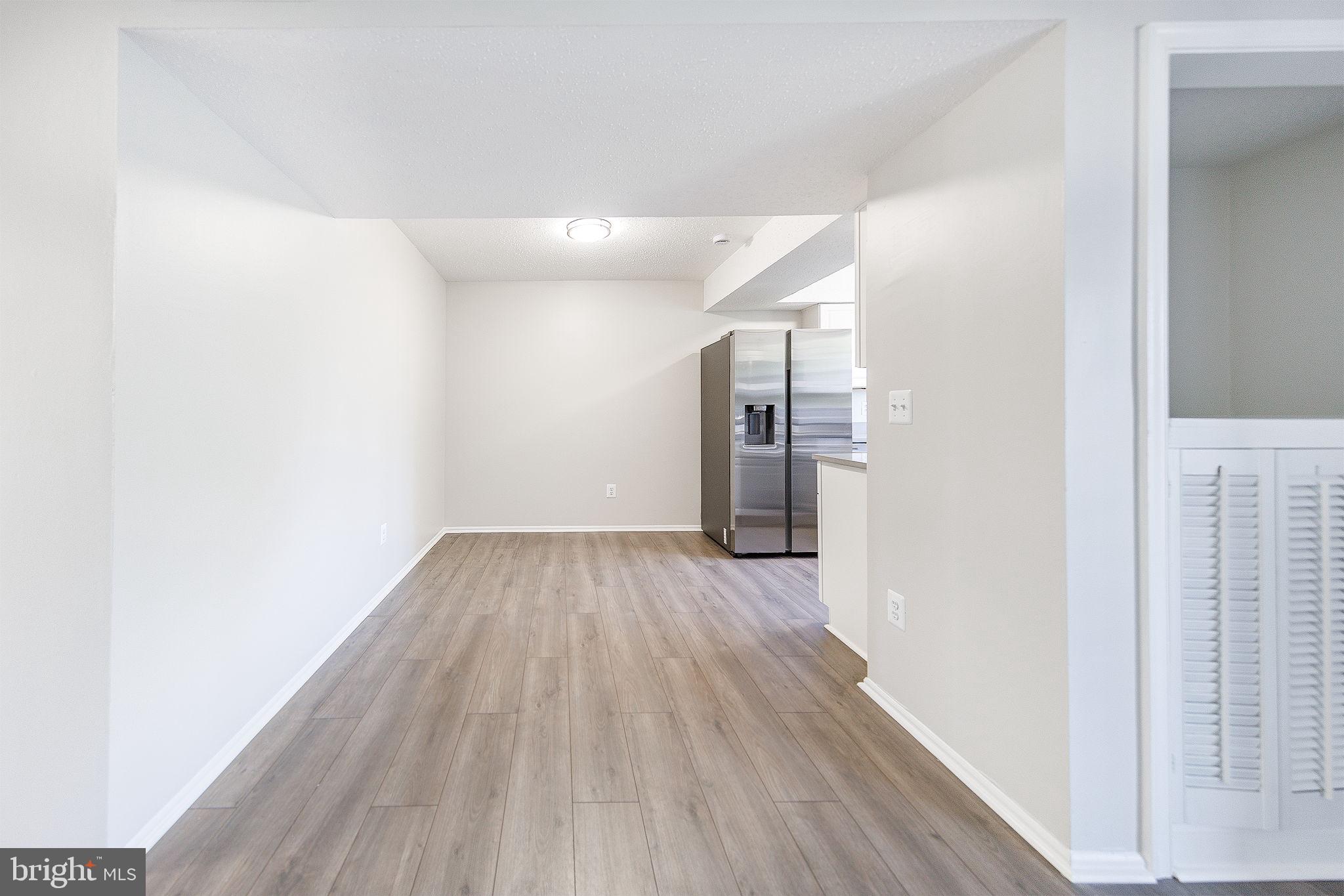 118 Fort Evans Road Southeast, Unit C Leesburg, VA 20175 - Photo 9 of 35 a view of hallway with wooden floor