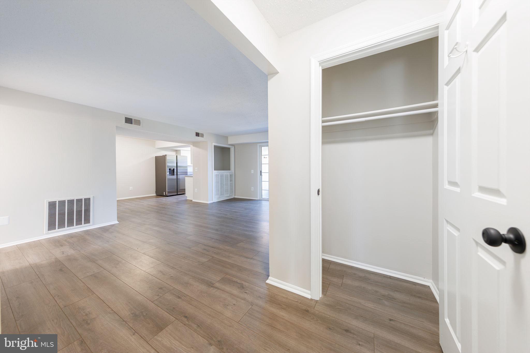 118 Fort Evans Road Southeast, Unit C Leesburg, VA 20175 - Photo 10 of 35 a view of a hallway with wooden floor