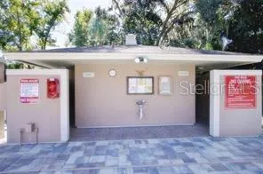 a view of a backyard with sitting area