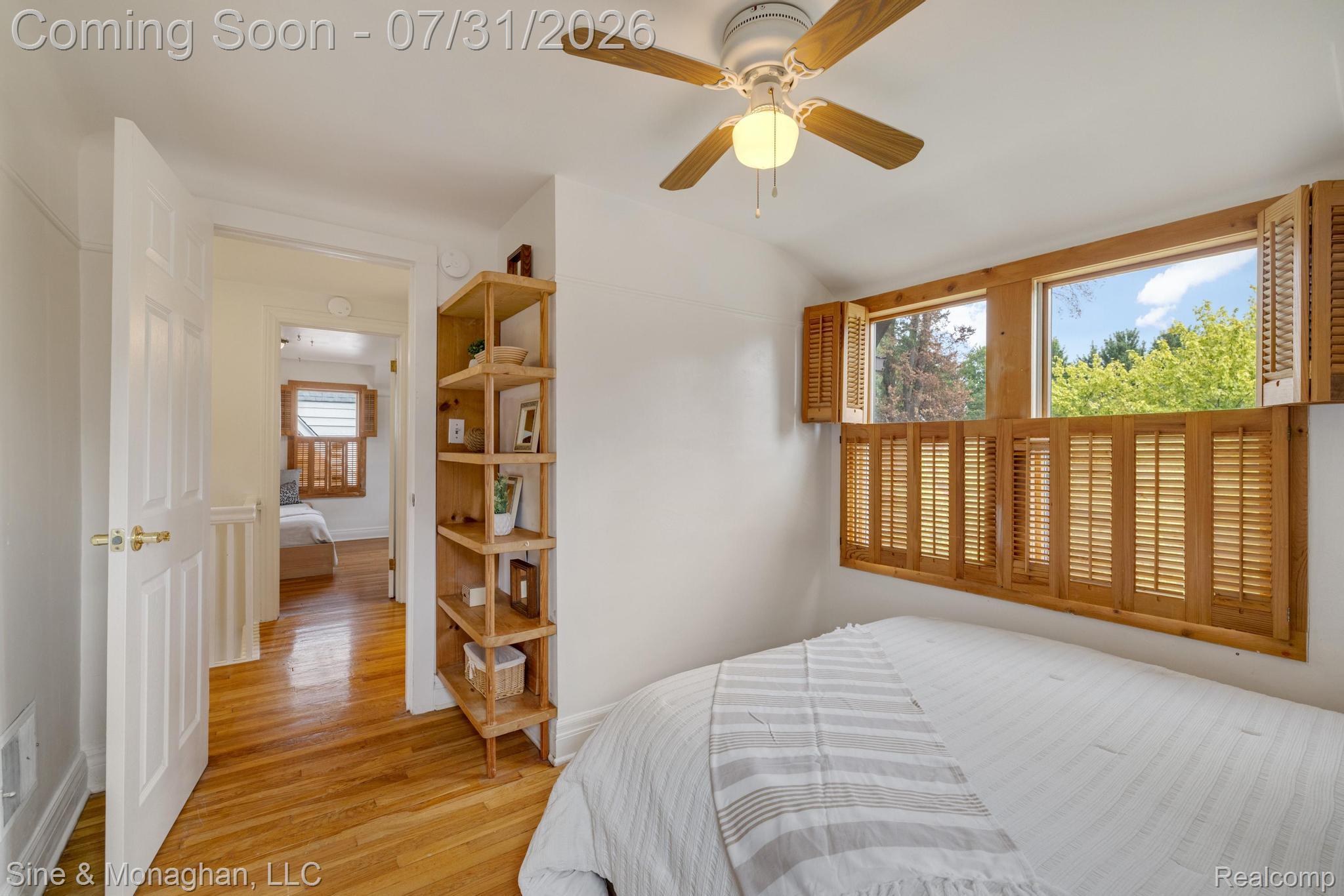417 Cloverly Road Grosse Pointe, MI 48236 - Photo 29 of 70 Room featuring hardwood flooring, a ceiling fan with light fixture, and window shutters