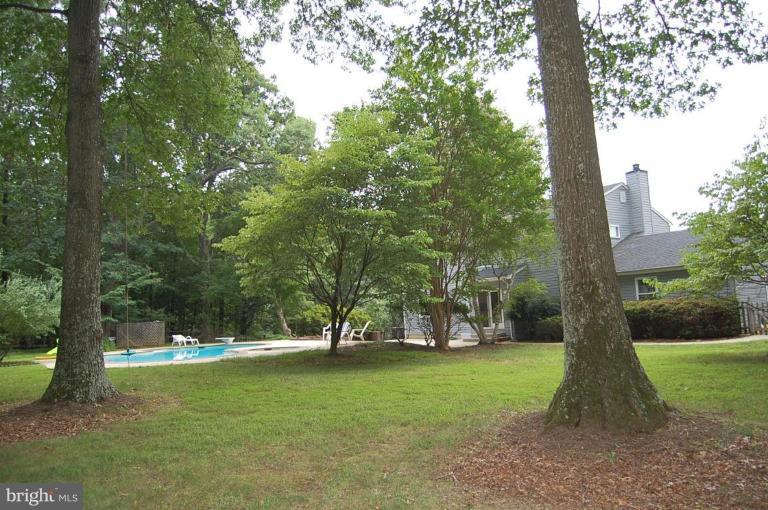 10901 Equestrian Court Reston, VA 20190 - Photo 13 of 18 Large expanse of grass and wooded privacy.