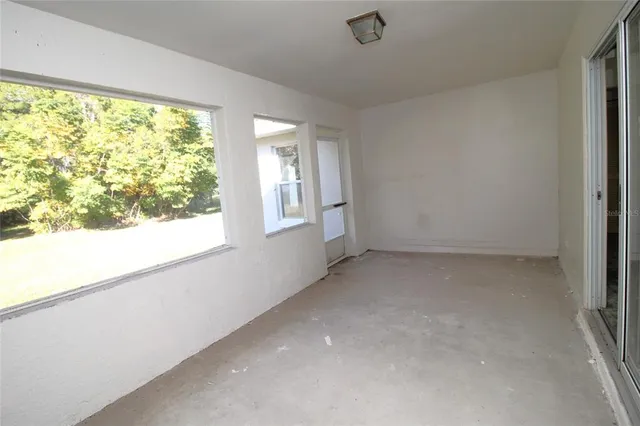 an empty room with windows