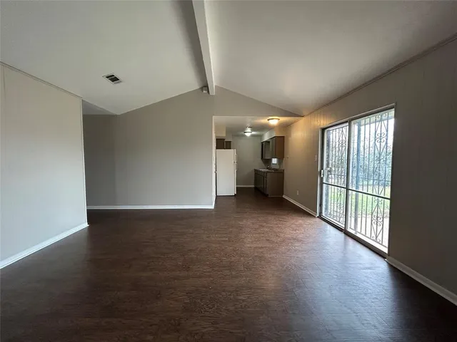 a view of a big room with windows