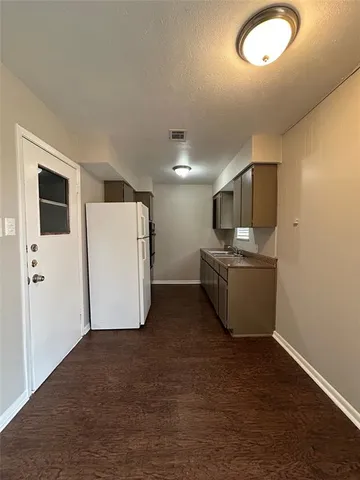 a view of a storage & utility room with two washing machine