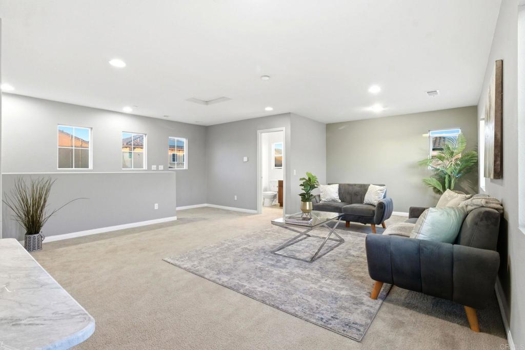 1508 Carpinteria Street Chula Vista, CA 91913 - Photo 19 of 39 a living room with furniture and wooden floor