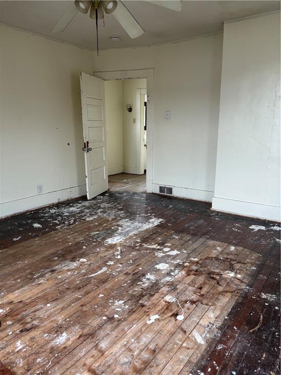 306 Park Road Ambridge, PA 15003 - Photo 32 of 43 a view of a room with an empty space and a ceiling fan