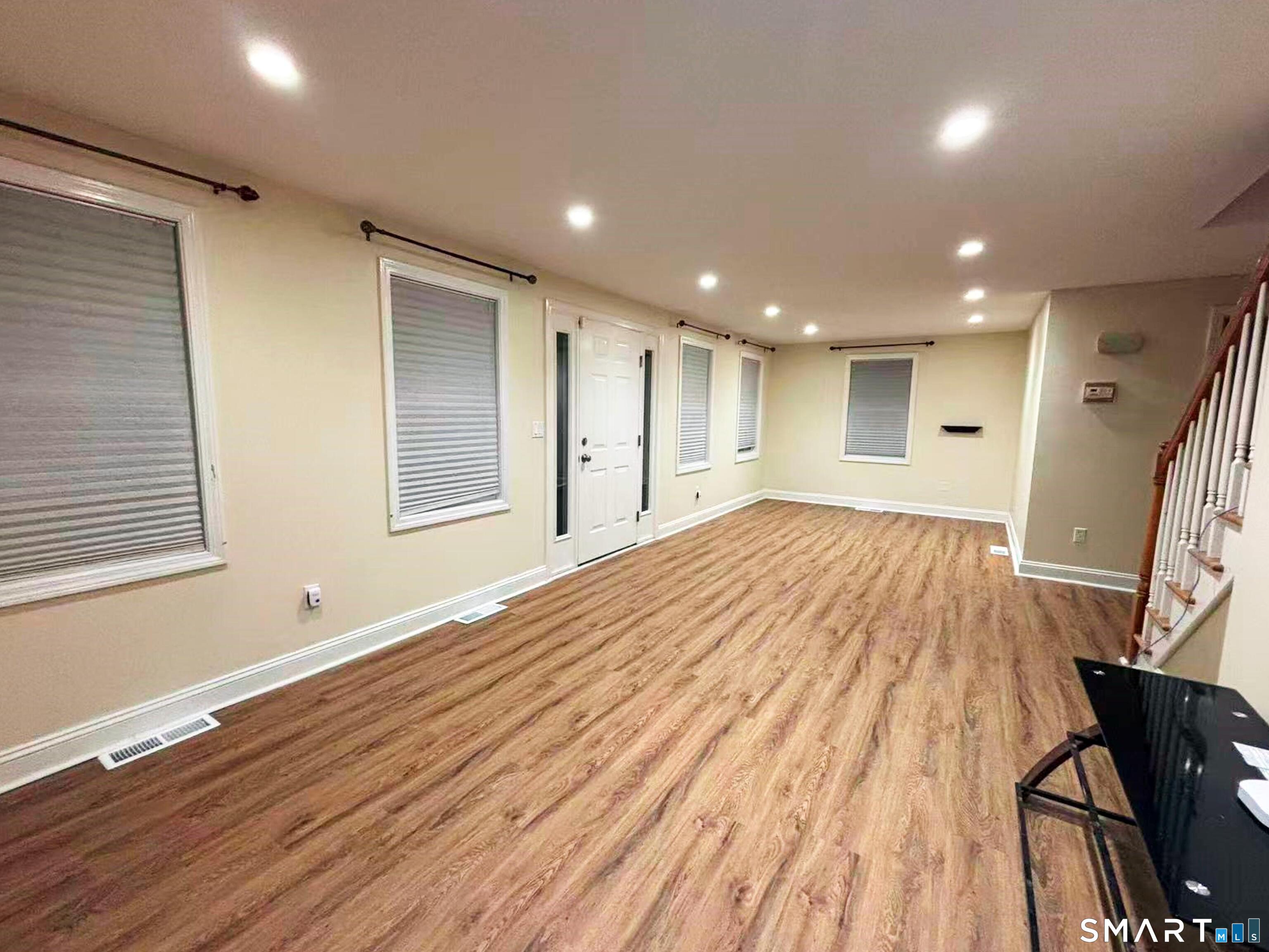 52 Monce Road Burlington, CT 06013 - Photo 5 of 26 a view of empty room with wooden floor