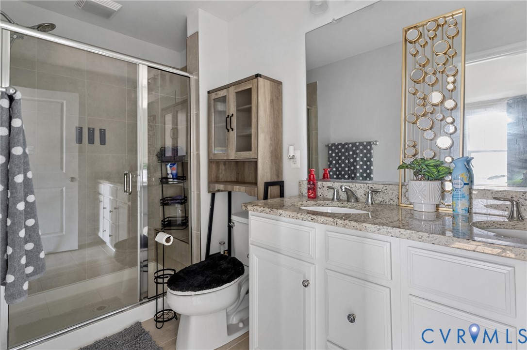 640 Rivanna Hill Road Glen Allen, VA 23060 - Photo 25 of 37 Spa-inspired primary bathroom featuring dual vanit