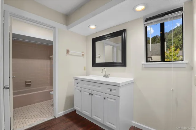 a view of a bathroom from the hallway