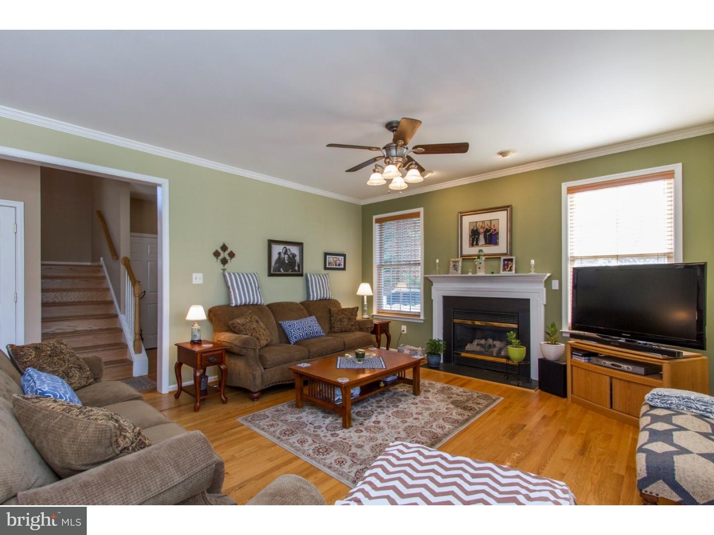 1728 Ridgeway Road Havertown, PA 19083 - Photo 13 of 25 a living room with furniture a flat screen tv and a fireplace