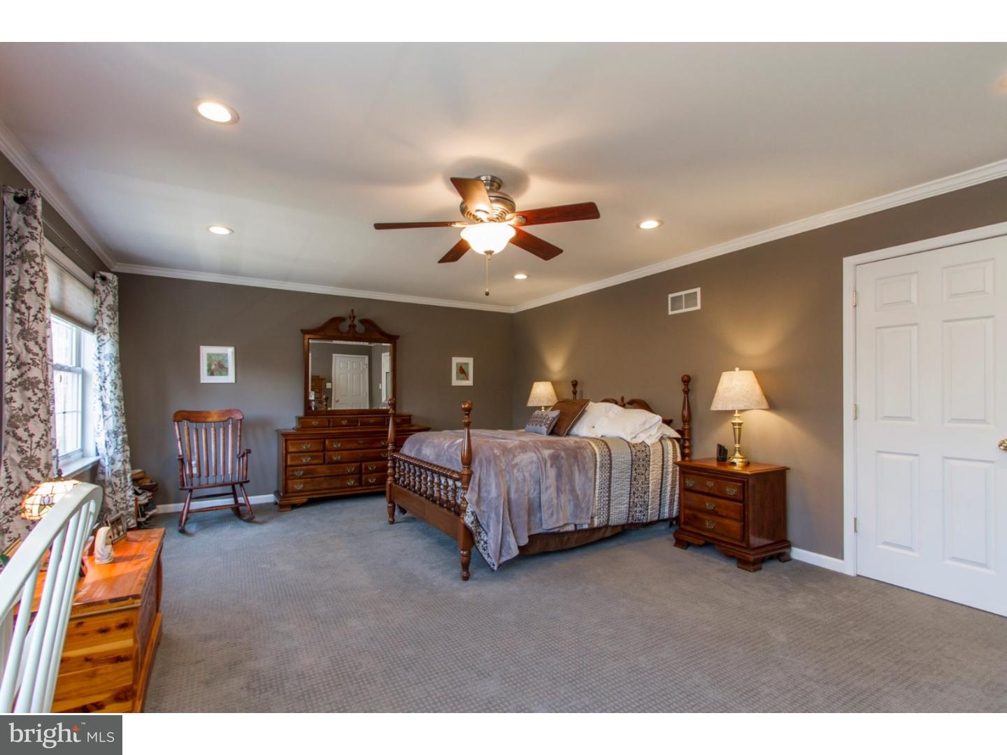 1728 Ridgeway Road Havertown, PA 19083 - Photo 16 of 25 a spacious bedroom with a bed and ceiling fan